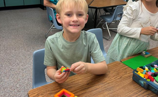 Student playing with magnatiles