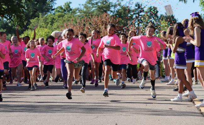 Large group of students at the starting line of a fundraiser fun run