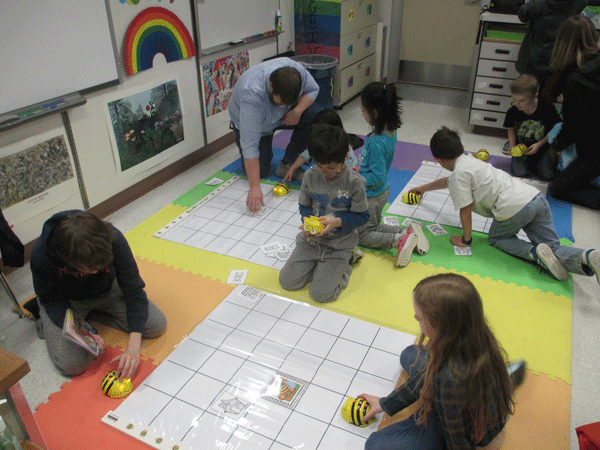 Students using Beebots