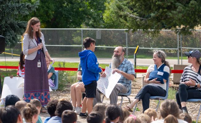 Student offering thanks to community members during Nature Center Ribbon Cutting Ceremony