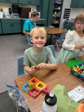 Student playing with magnatiles